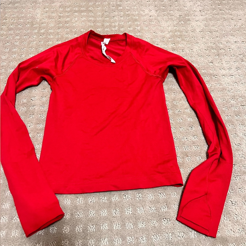 Women’s like red swiftly tech in size 2.